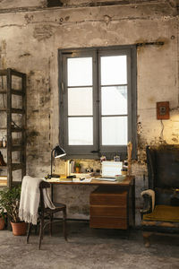 Desk with laptop in a loft