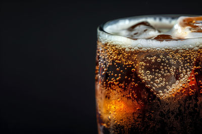 Close-up of drink against black background