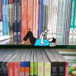 Graffiti on books in shelf