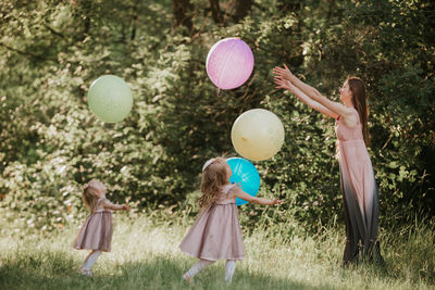 High angle view of girl playing with balloons