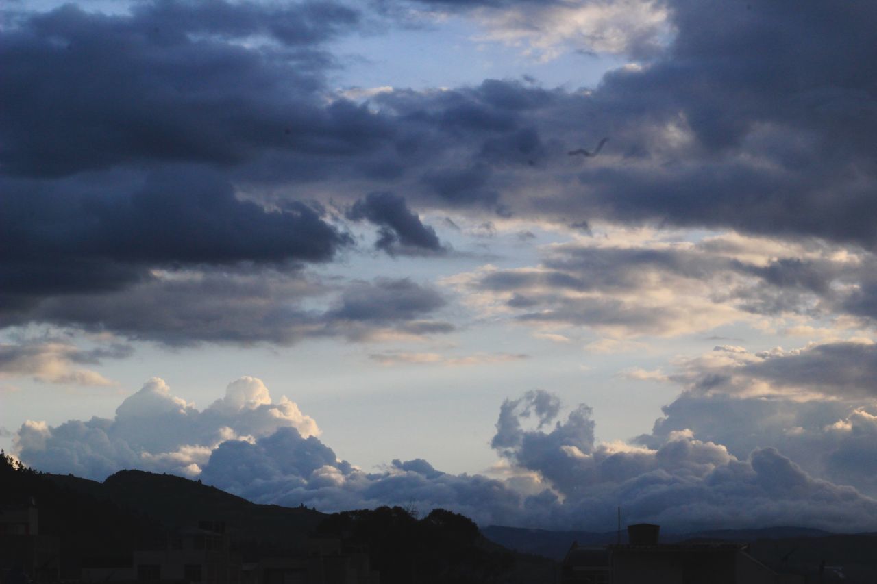 SILHOUETTE OF BUILDINGS AT SUNSET