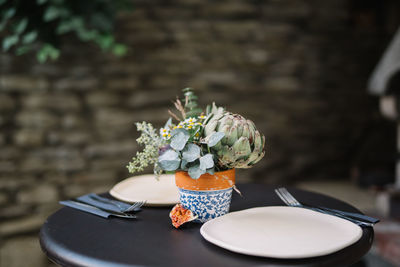 Close-up of potted plant in vase on table