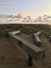 Scenic view of land against sky during sunset