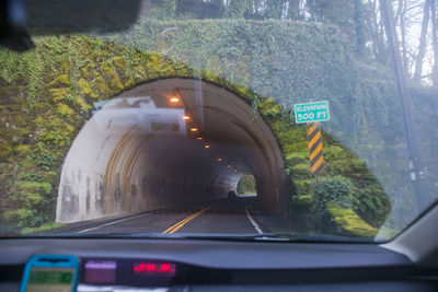 Car on road seen through windshield