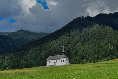 Scenic view of green landscape against sky