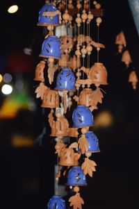 Close-up of toys hanging at market stall