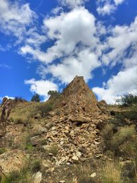 Low angle view of rock formations against sky