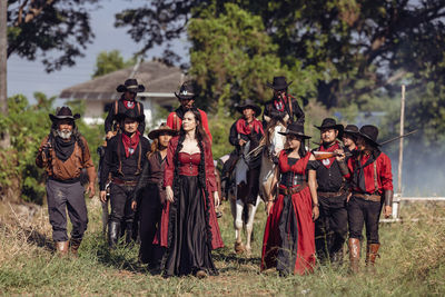 On a sunny day at the horse farm in thailand's central region near bangkok, a group of horse rider.