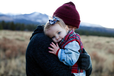 Portrait of cute boy in park during winter