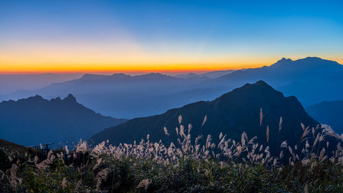 Scenic view of mountains against sky during sunset