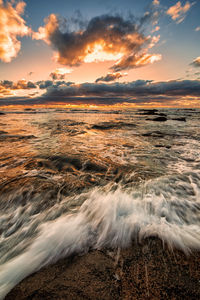 Scenic view of sea against sky during sunset