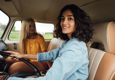 Portrait of woman sitting in car