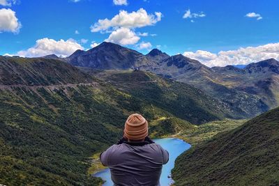 Rear view of man looking at mountains