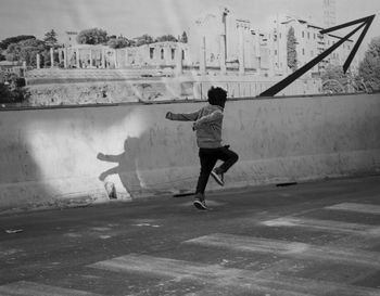 Rear view of man running