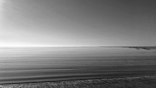 Scenic view of calm sea against clear sky