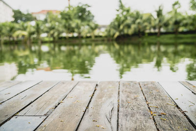 Close-up of pier over lake