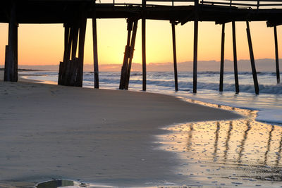 Scenic view of sea against sky at sunset