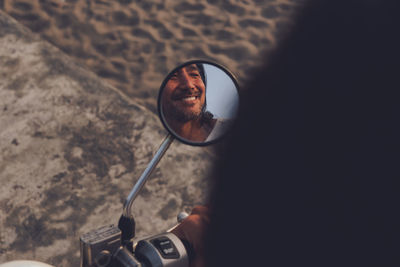 Close-up of man holding camera