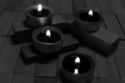 High angle view of tea light candles on table