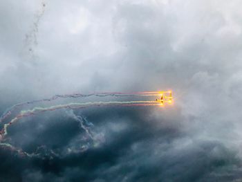 Low angle view of airplane flying in sky