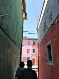 Rear view of people on buildings in city