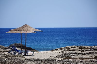 Scenic view of sea against clear blue sky