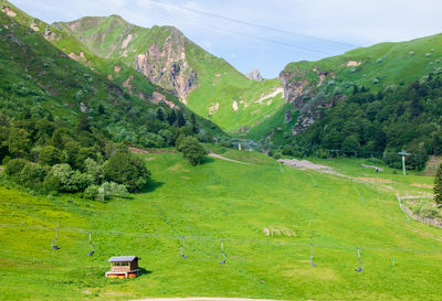 Scenic view of green landscape and mountains