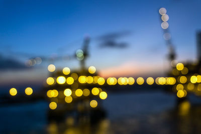 Defocused image of illuminated lights at night