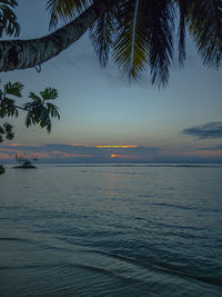 Scenic view of sea against sky at sunset