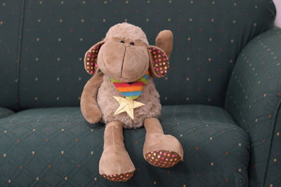 Close-up of stuffed toy on sofa