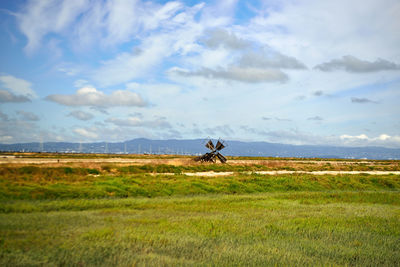 People riding bicycle on field