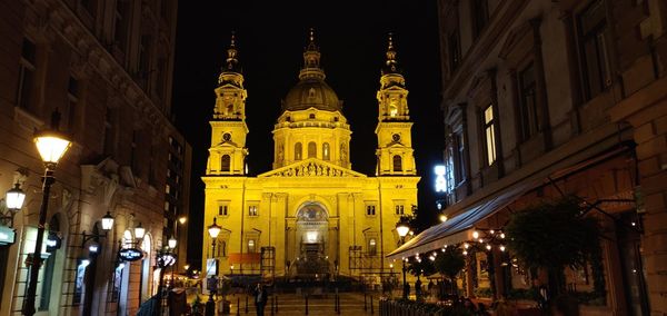 Illuminated buildings in city at night