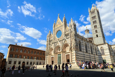  group of people in front of  siena cathedral