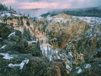 Scenic view of grand canyon of the yellowstone against cloudy sky during winter season