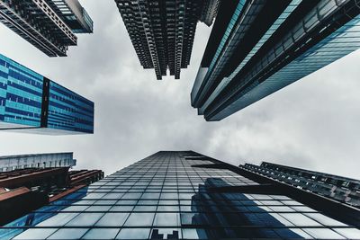 Low angle view of building against cloudy sky