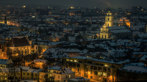 High angle view of illuminated buildings in vilnius city. vilnius cityscape at night. aerial view