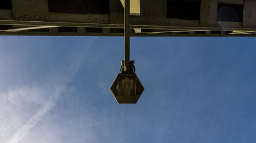 Low angle view of street light against sky