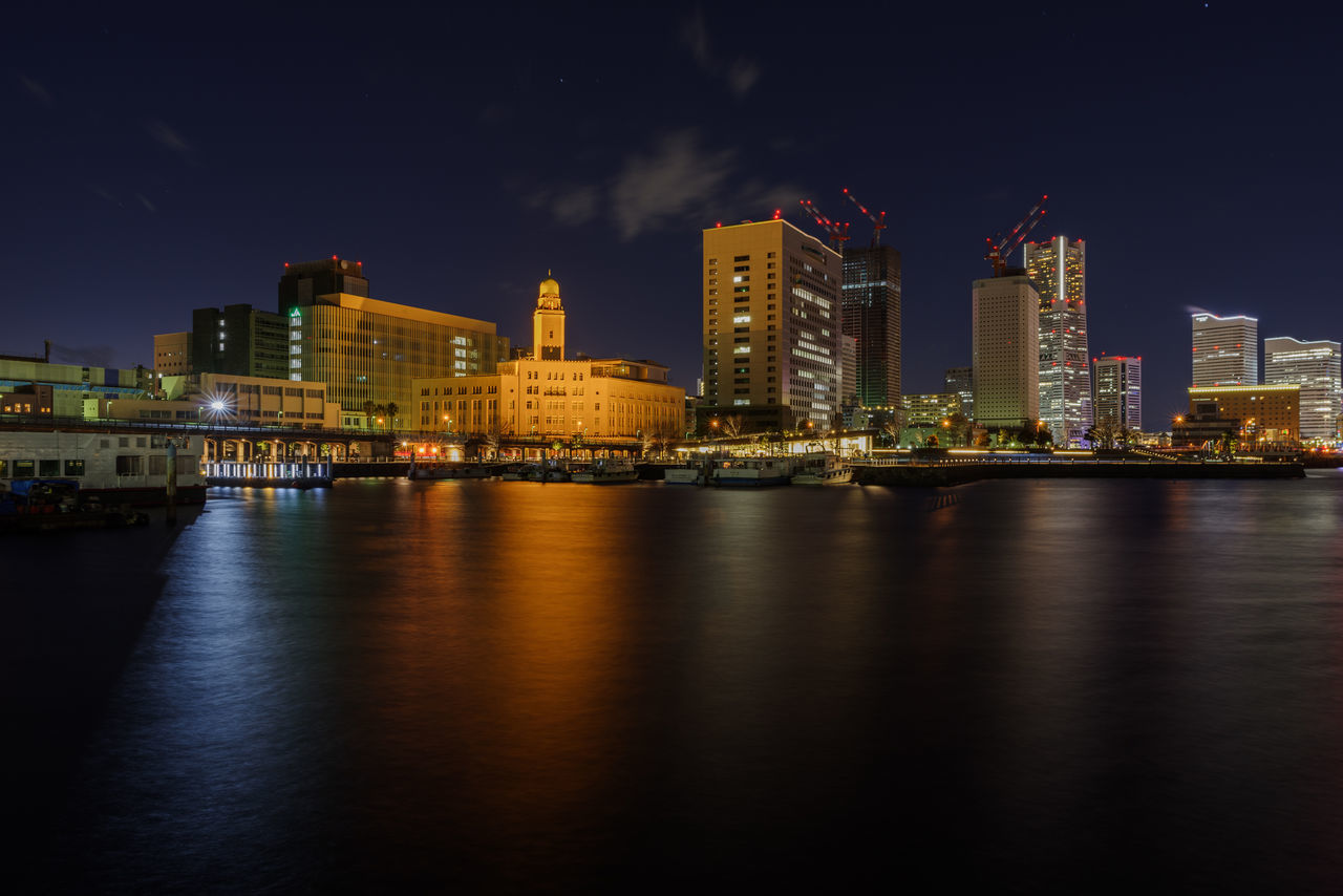 building exterior, architecture, built structure, city, water, sky, illuminated, waterfront, building, night, nature, river, no people, reflection, landscape, office building exterior, cloud - sky, urban skyline, skyscraper, modern, outdoors, cityscape, financial district