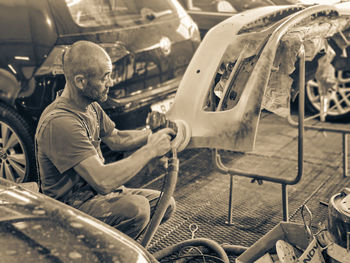 Man working in car