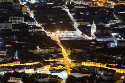 High angle view of illuminated buildings in city at night