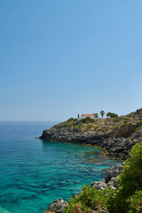 Scenic view of sea against clear blue sky