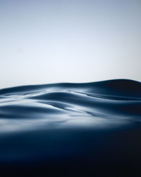 Close-up of water splashing against sky