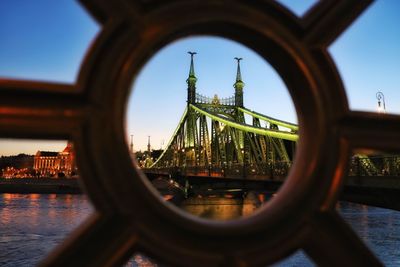 View of buildings seen through bridge