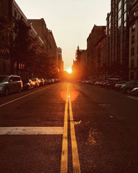 View of city street at sunset