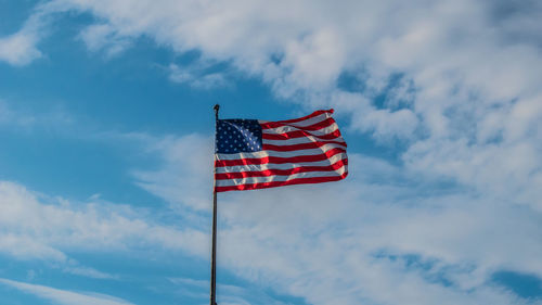 Low angle view of flag against sky