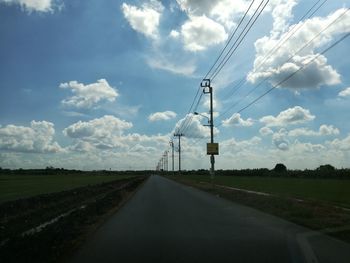 View of road against cloudy sky