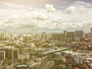 Aerial view of cityscape against sky