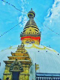 Low angle view of temple against blue sky