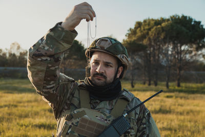Portrait of man standing on field