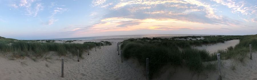 Panoramic view of sea against sky during sunset